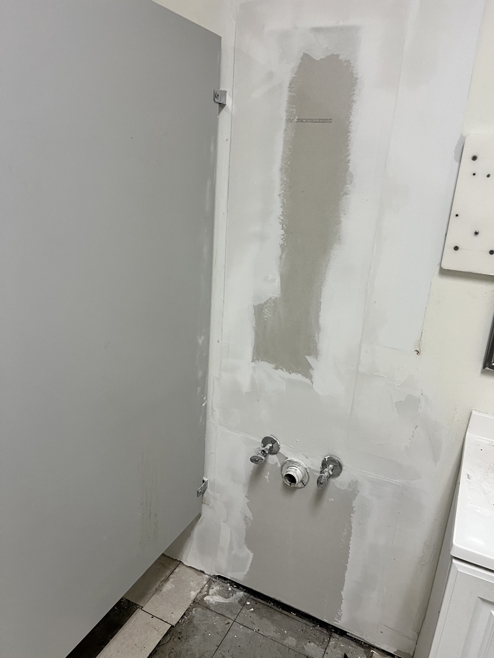 Finished drywall mud work on restroom wall