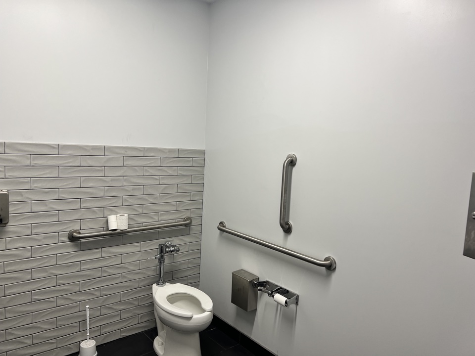 Commercial restroom with painted walls and tile