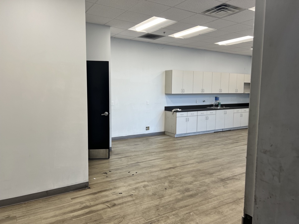 Break room with painted walls and cabinets