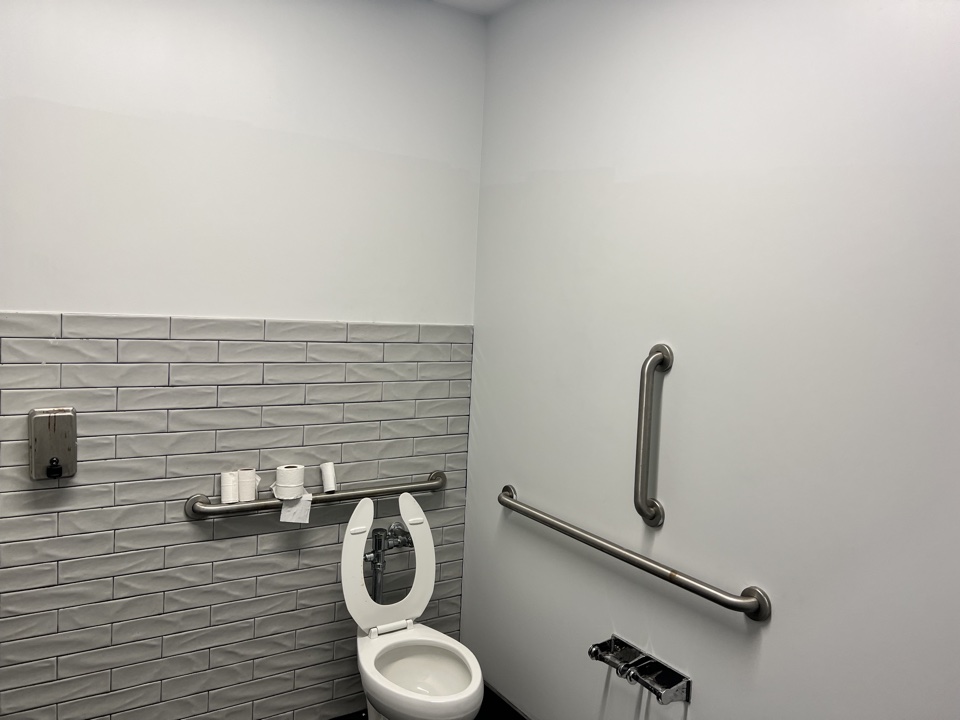 Restroom detail showing paint finish around fixtures