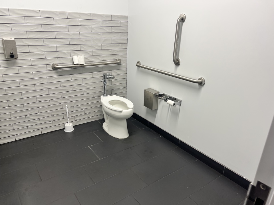 Wide view of painted commercial restroom
